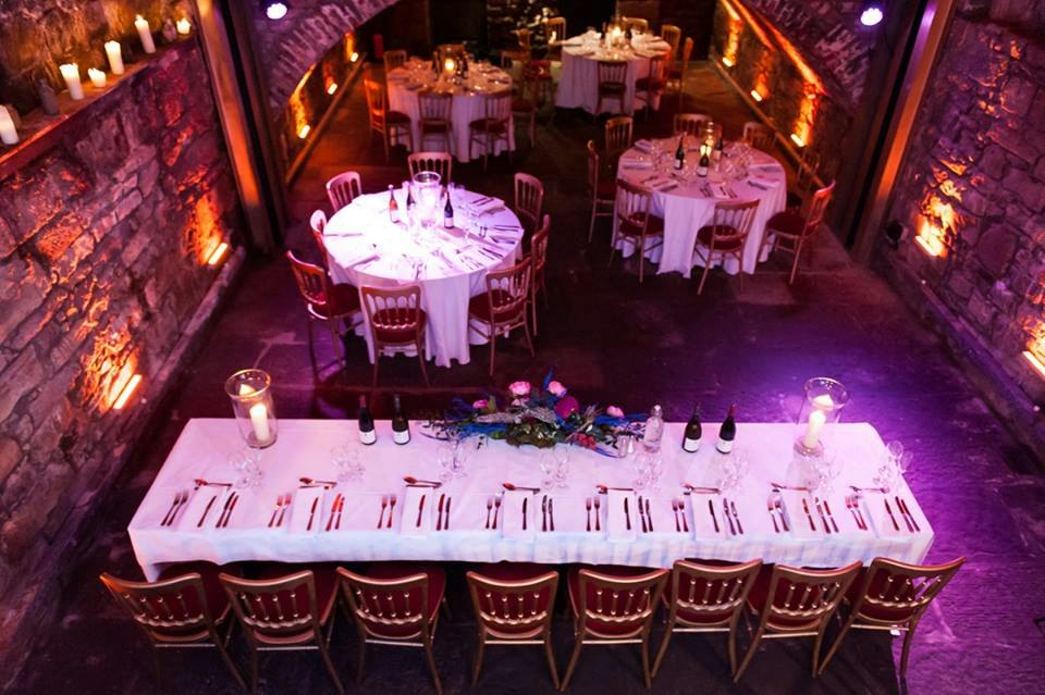 Vaulted Cellars event space with elegant dining setup and ambient lighting for celebrations.