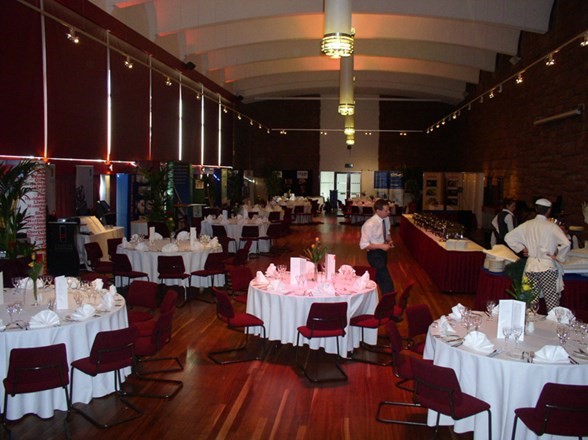 Elegant event space in South Hall with round tables, perfect for meetings and gatherings.