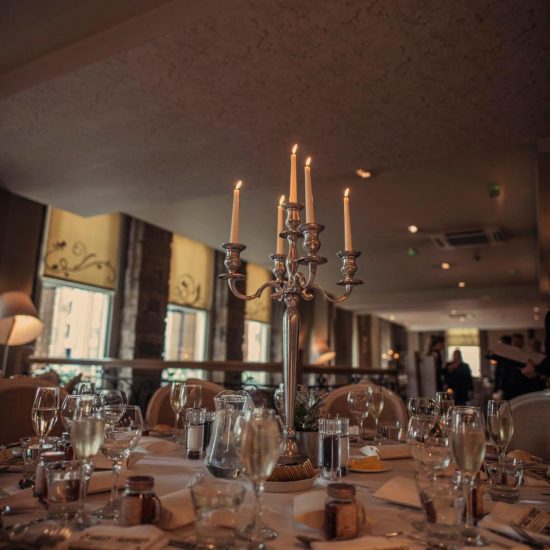 Elegant wedding table setting with candelabra in Citation Glasgow for upscale events.