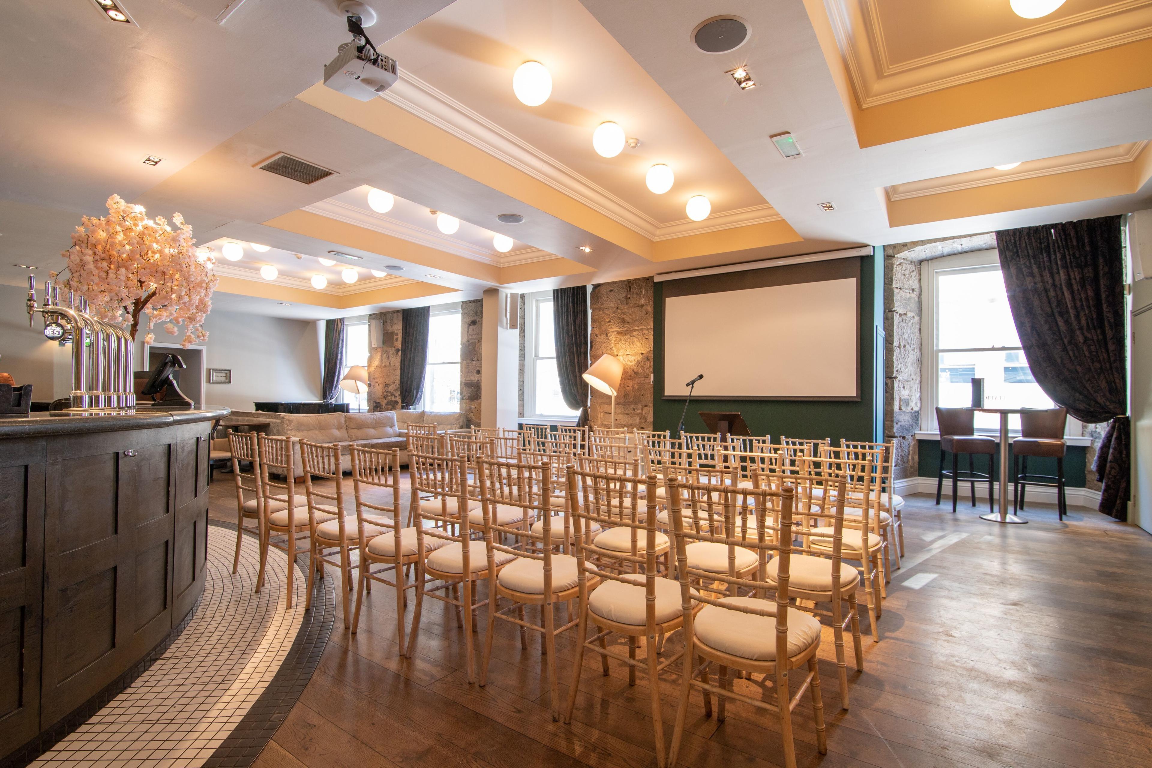 Versatile event space in Citation Glasgow, featuring elegant wooden flooring for presentations.