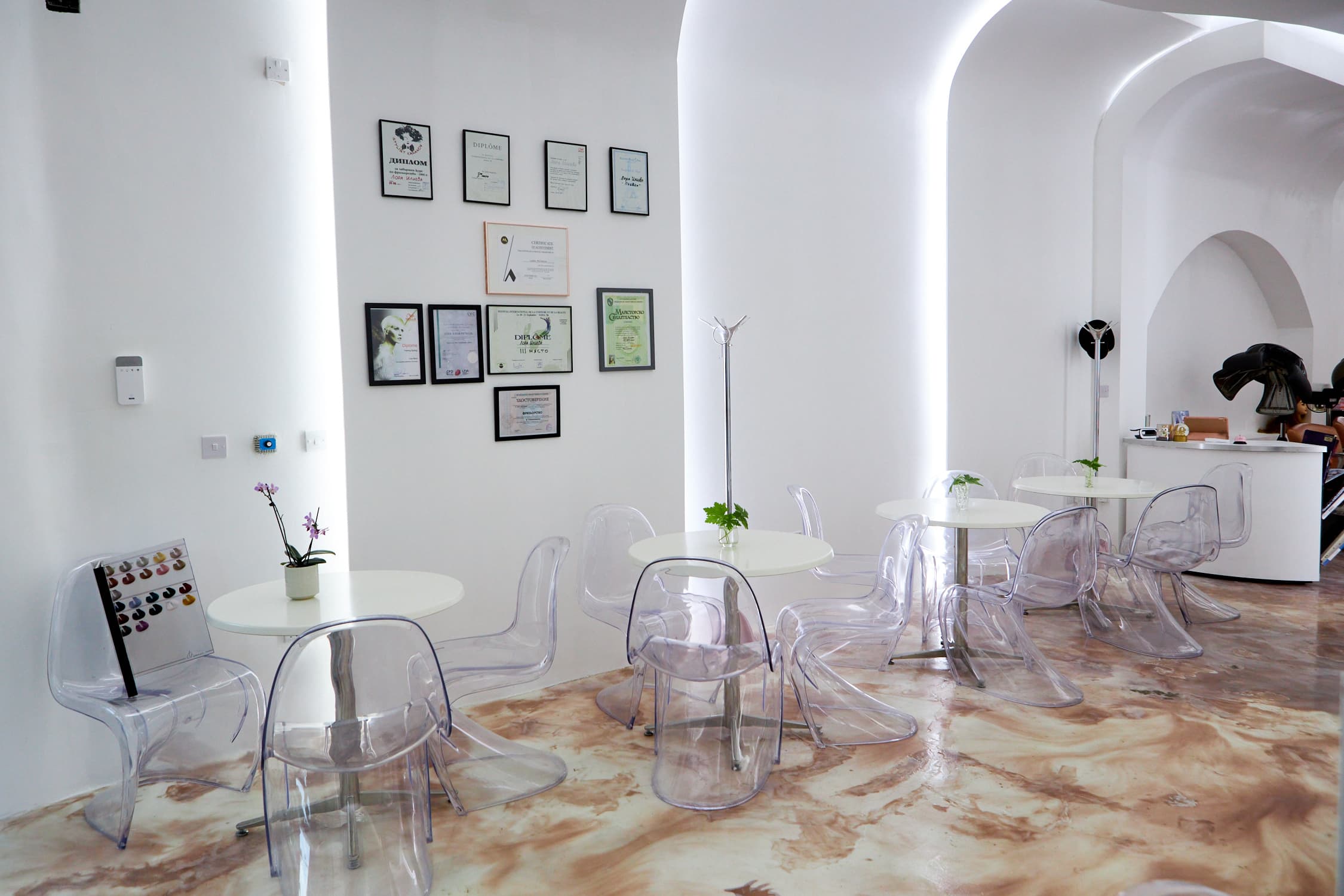 Modern minimalist meeting space with transparent chairs for creative gatherings.