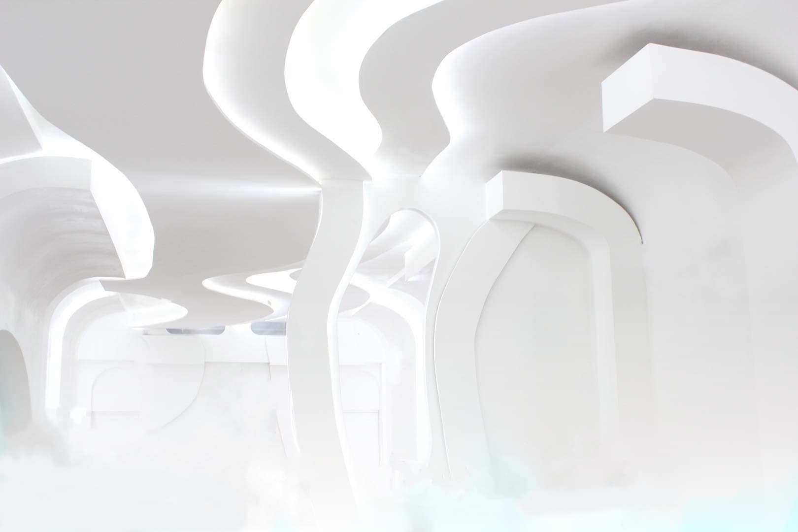 Modern minimalist event space with fluid lines, perfect for meetings and gatherings.