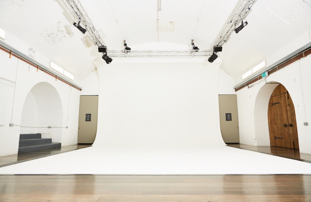 White Rabbit Cafe event space with bright white backdrop, ideal for workshops and photo shoots.