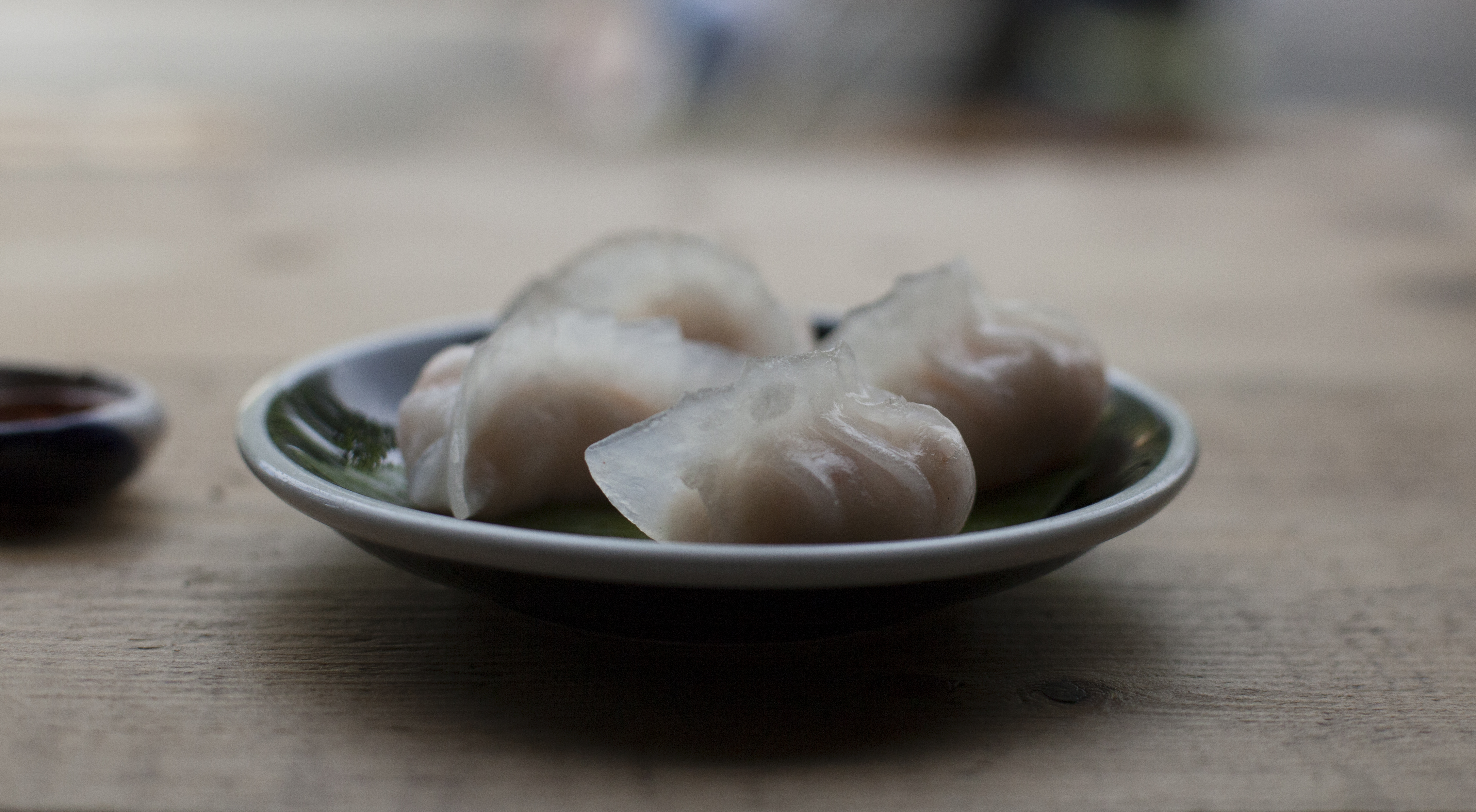 Elegant dumpling plate in Hanging Garden Room for networking culinary event.