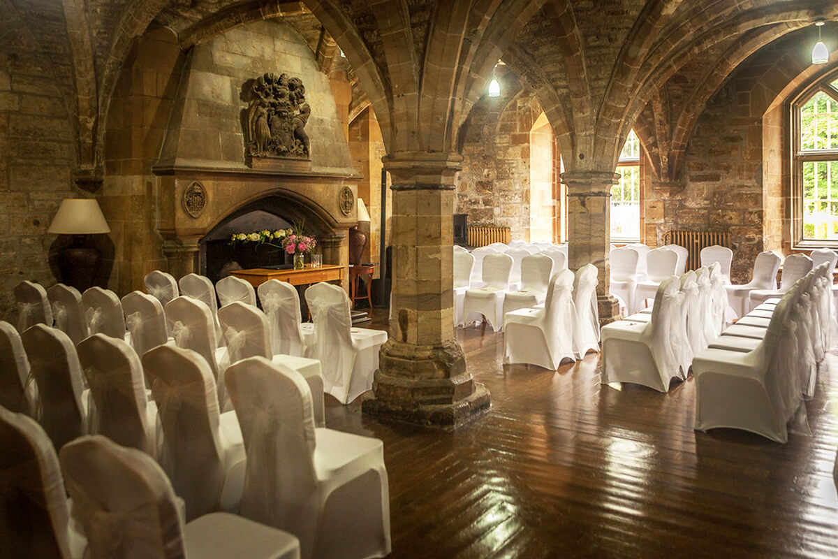 19th Century Italian Gardens at Newbattle Abbey, elegant wedding venue with white chair covers.