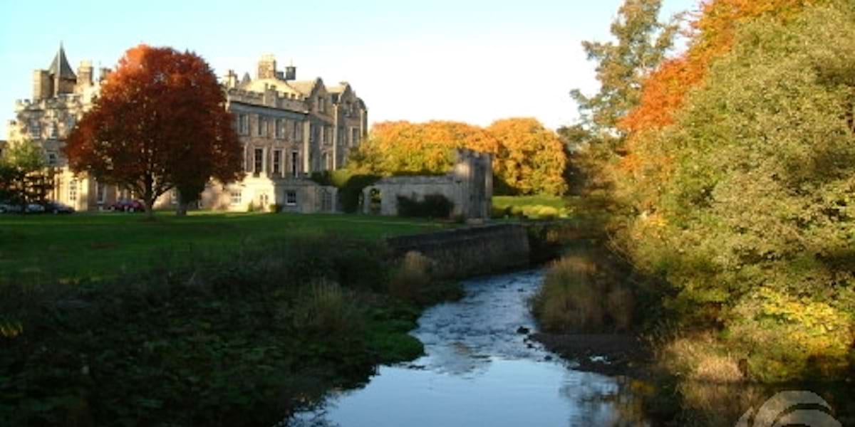 Chapel at Newbattle Abbey, vibrant autumn backdrop, ideal for outdoor events and gatherings.