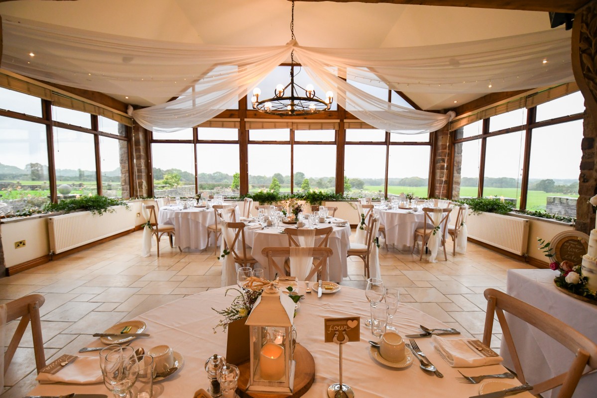 Elegant round tables in Beeston Manor bar, perfect for weddings and corporate events.