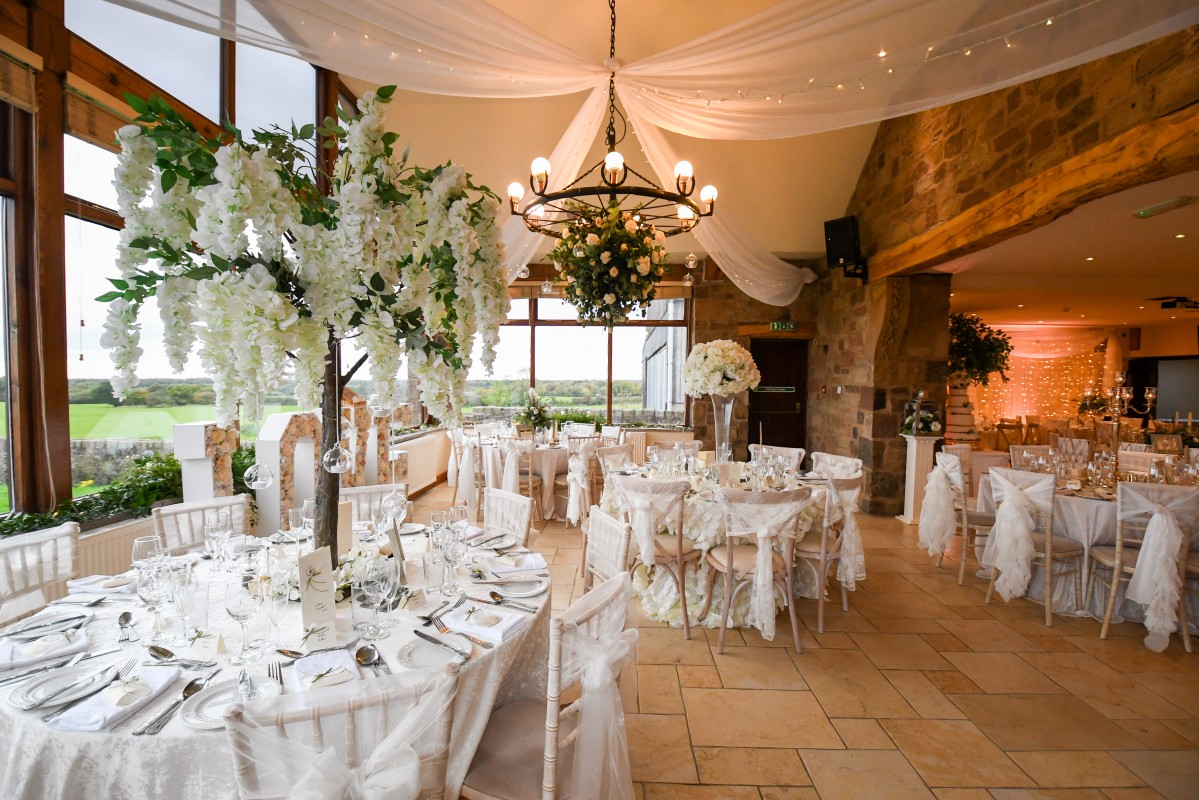 Elegant Beeston Manor bar with fine china, perfect for weddings and upscale events.