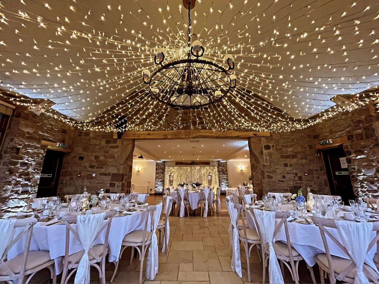 Elegant Woodlands Suite at Beeston Manor with chandelier, perfect for weddings and events.