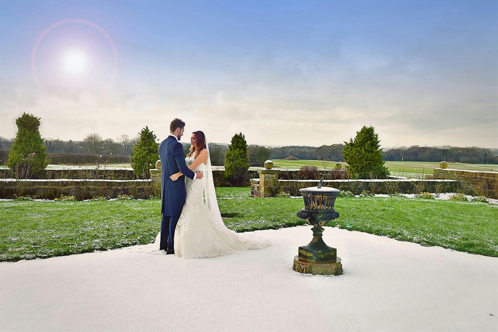 Outdoor wedding at Beeston Manor's Woodlands Suite with snow-dusted lawn and serene landscape.