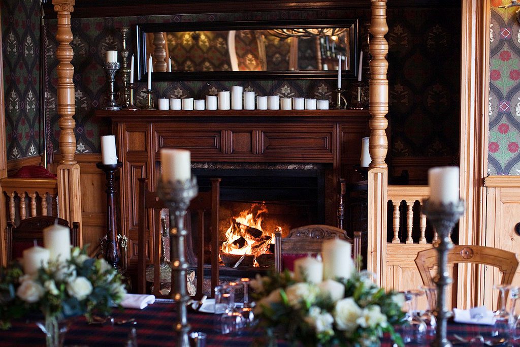 Arts & Crafts dining room with fireplace, ideal for upscale events and intimate gatherings.