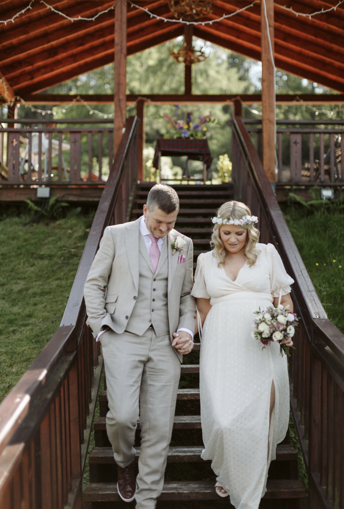 Couple eloping at Woodside Lodge, bride in floral crown, perfect for weddings and events.