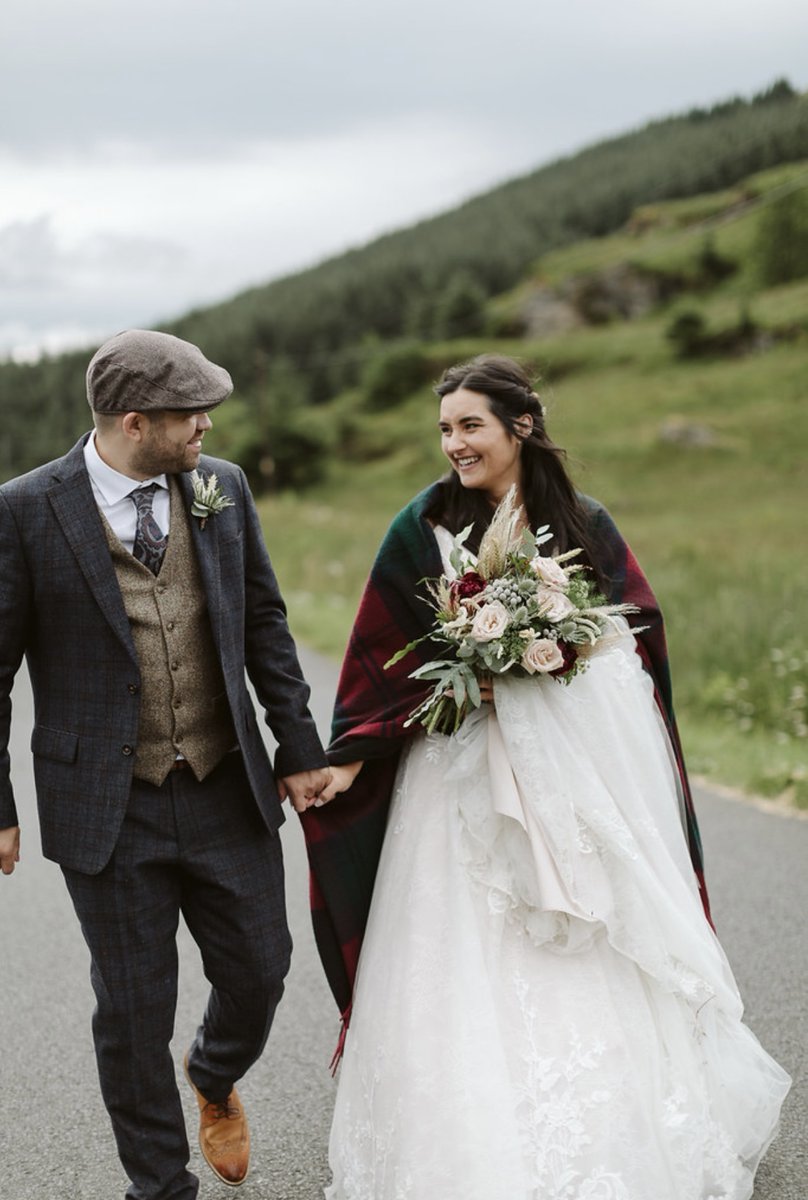 Couple eloping at Woodside Lodge, surrounded by lush greenery and romantic lighting.