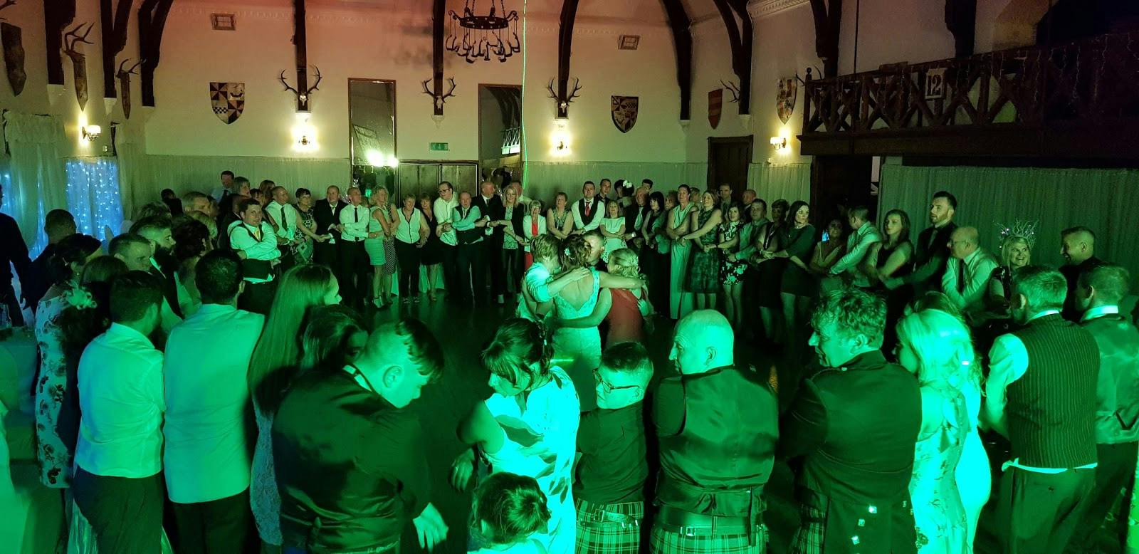 Ballroom at Argyllshire Gathering, vibrant dance event with dynamic lighting.
