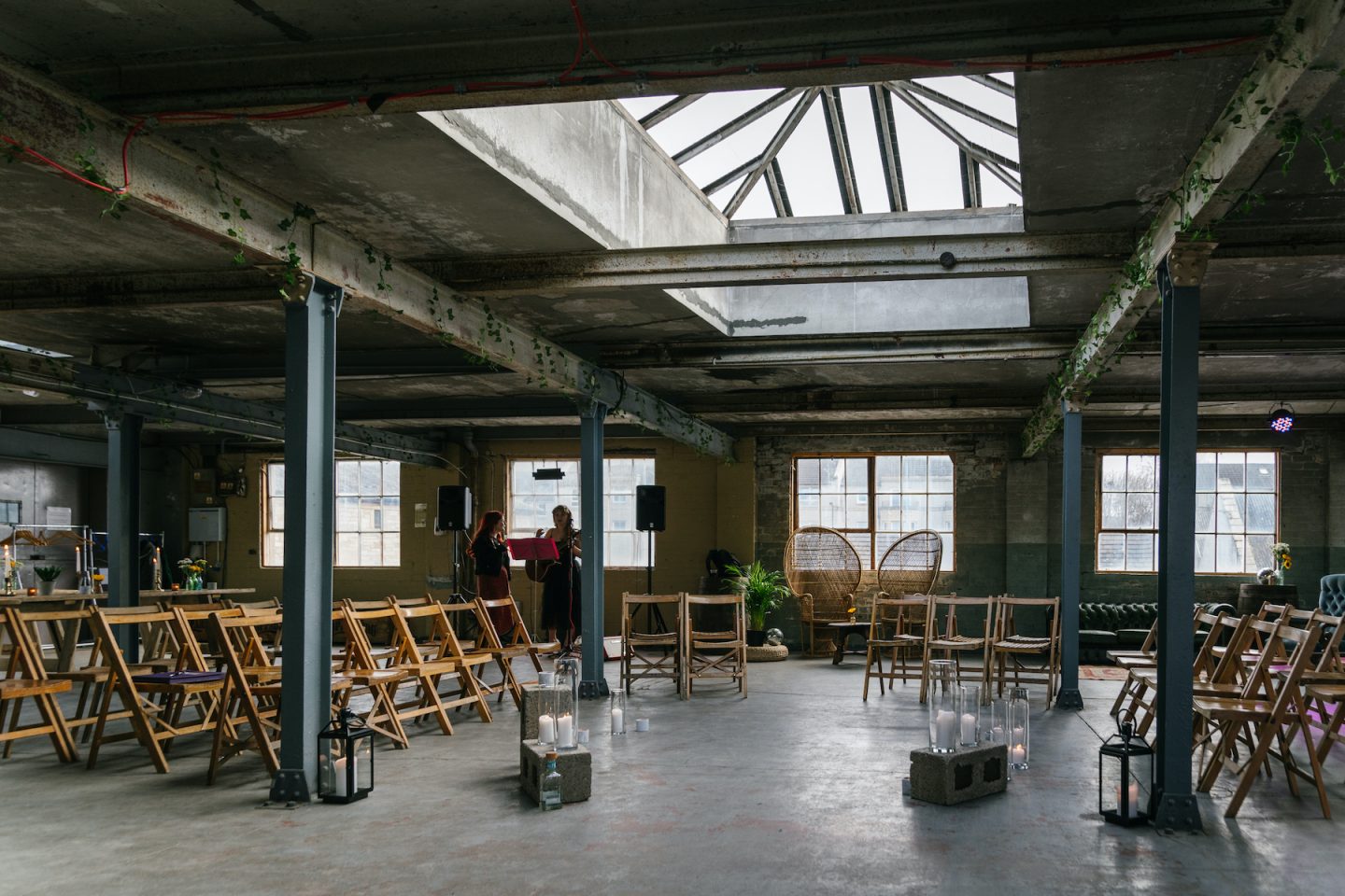 Versatile event space in The Biscuit Factory with skylight, ideal for workshops and ceremonies.