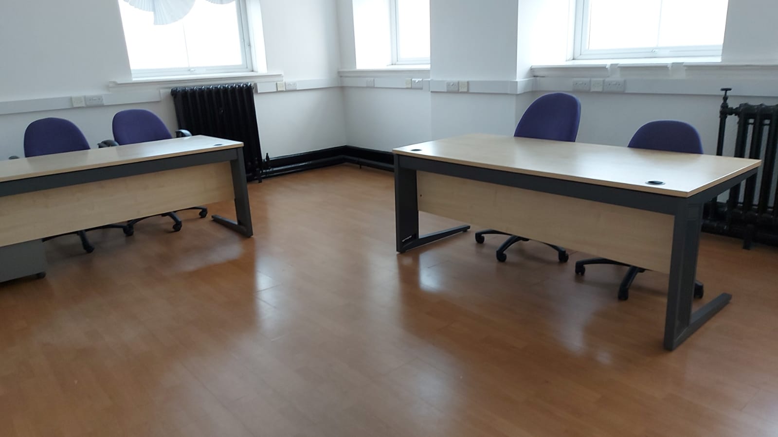 Minimalist meeting room at Crown House, ideal for workshops and small group discussions.