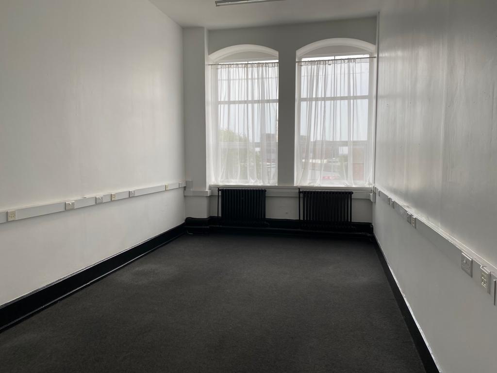 Minimalist meeting room in Crown House, ideal for workshops with natural light.