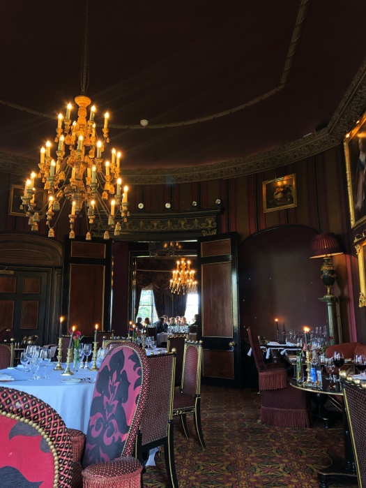Elegant dining room at Rhubarb Restaurant with grand chandelier for upscale events.
