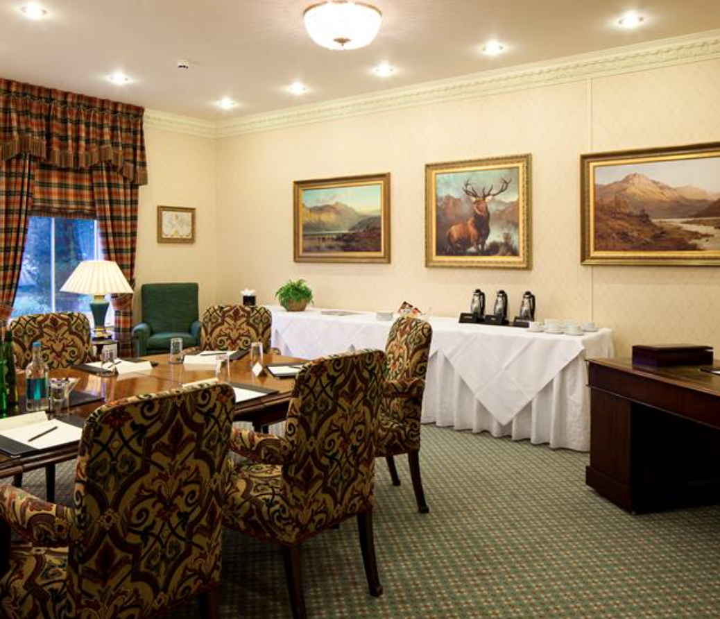 Elegant meeting room with plush chairs for intimate gatherings and professional events.