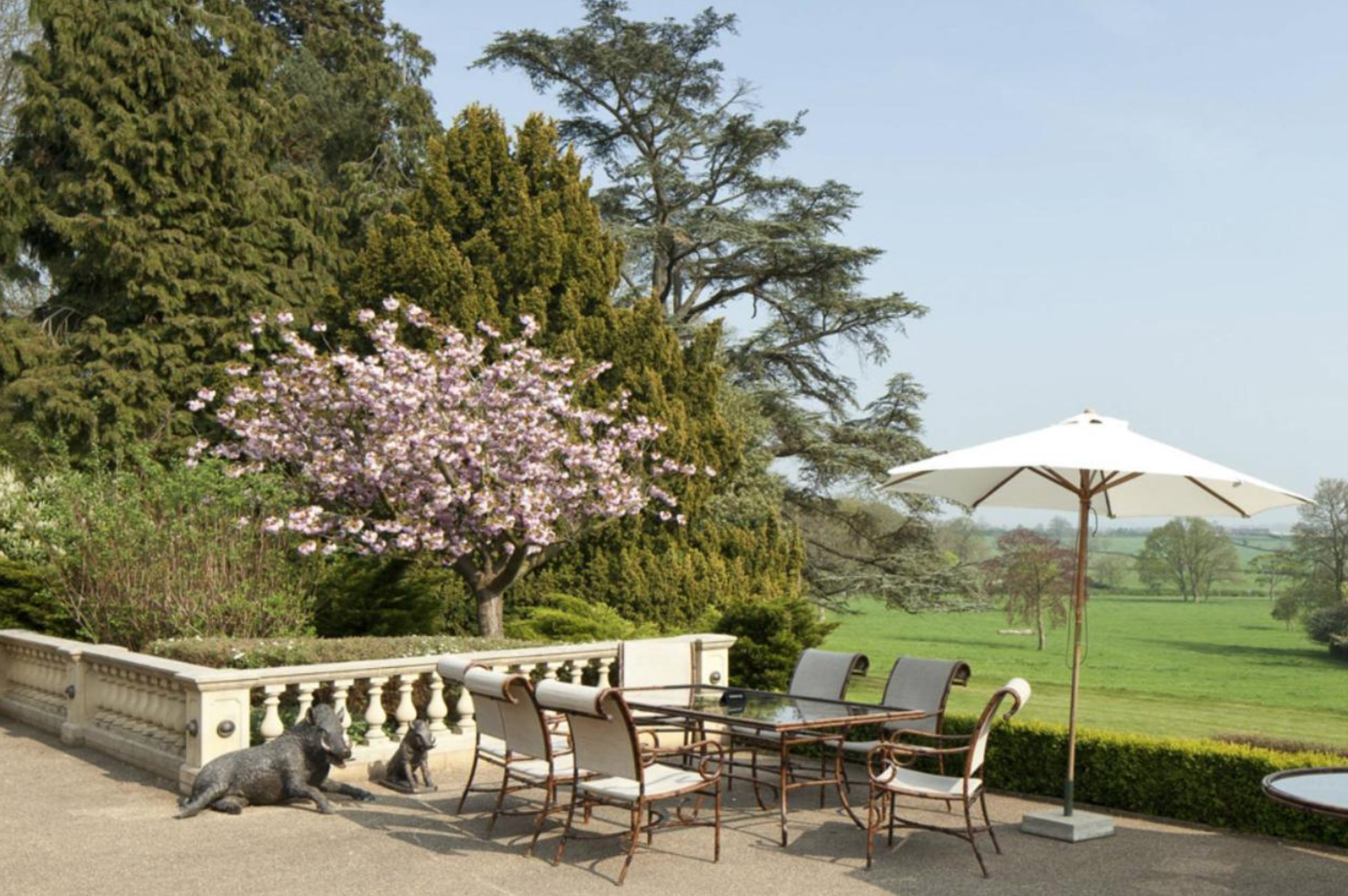 Elegant outdoor venue with patio seating, perfect for alfresco events and receptions.