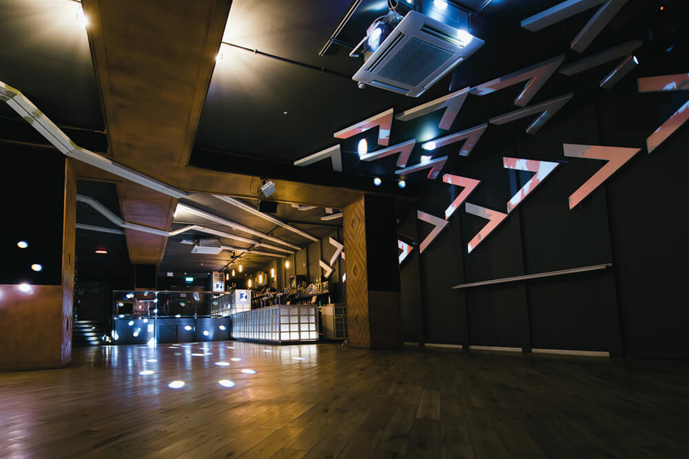 Modern event space with ambient lighting for corporate meetings and social gatherings.