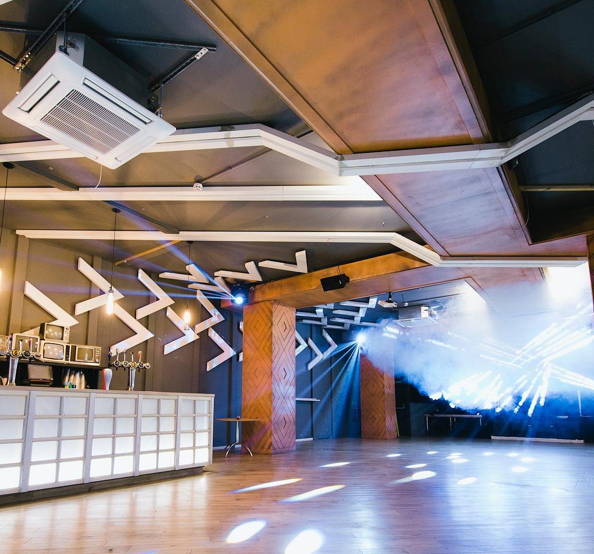 Modern event space at La Belle Angele with dynamic lighting for corporate meetings and gatherings.