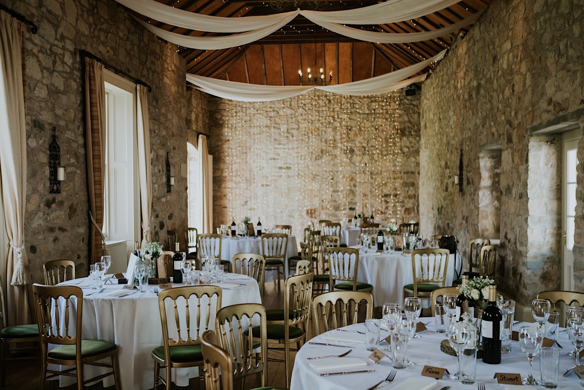 Kirknewton House Stables event space with elegant tables, perfect for weddings and gatherings.