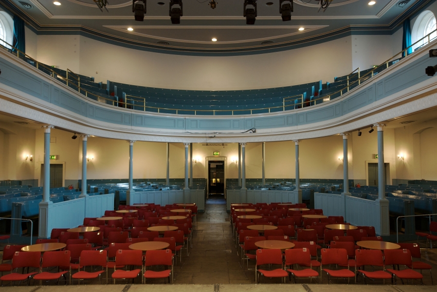 Auditorium in The Queen's Hall with tiered seating for conferences and performances.