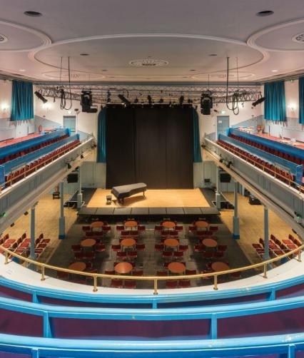 Box Office at The Queen's Hall: spacious auditorium with grand piano for events and performances.