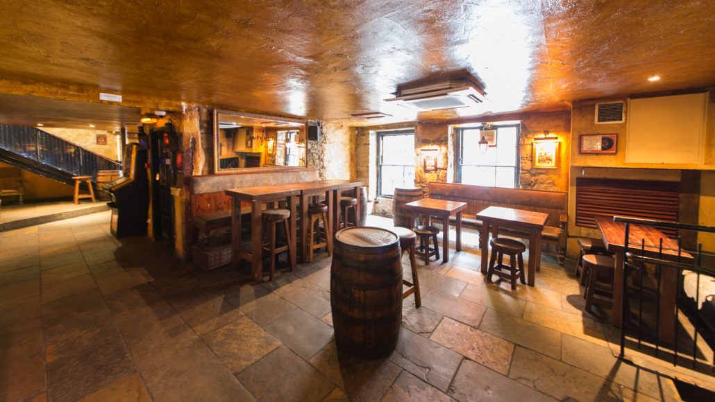 Cozy rustic venue with warm wood tones, perfect for intimate gatherings and networking events.