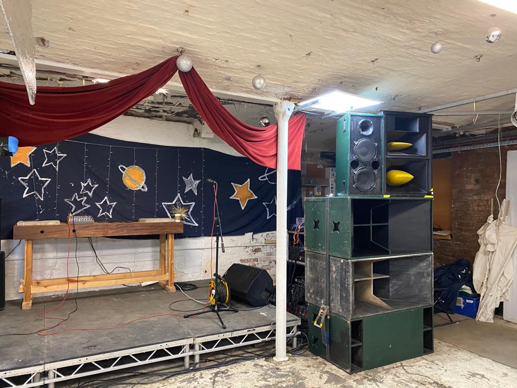 Partisan Venue with starry stage backdrop for live performances and themed events.
