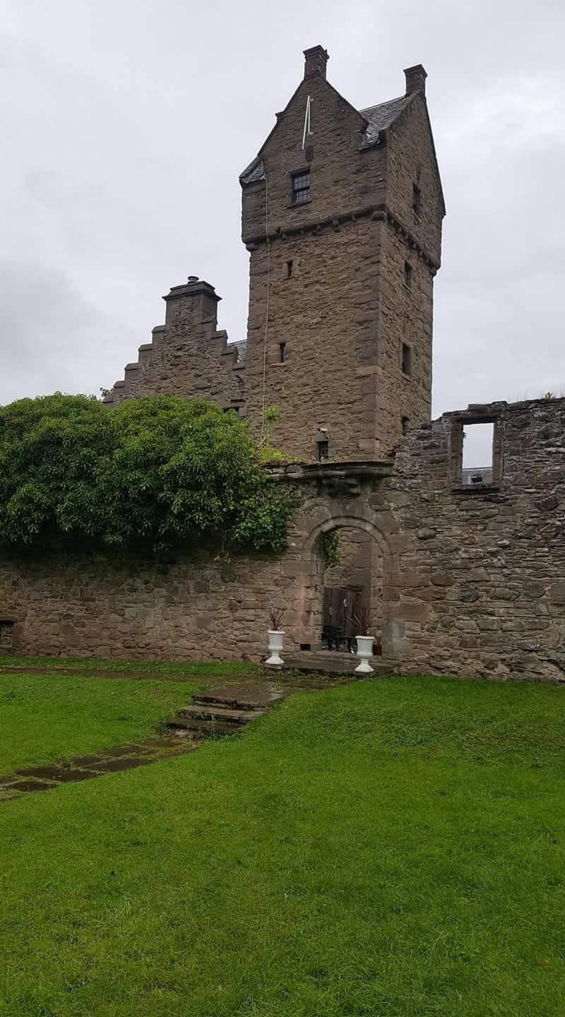 Mains Castle courtyard: historic stone venue for weddings and outdoor events.