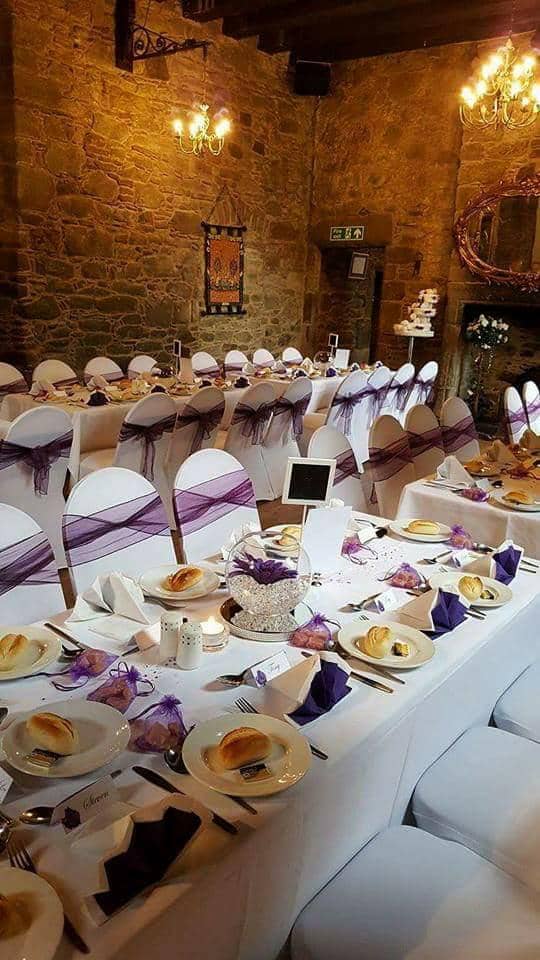 Elegant banquet setup in Mains Castle courtyard for weddings and formal events.