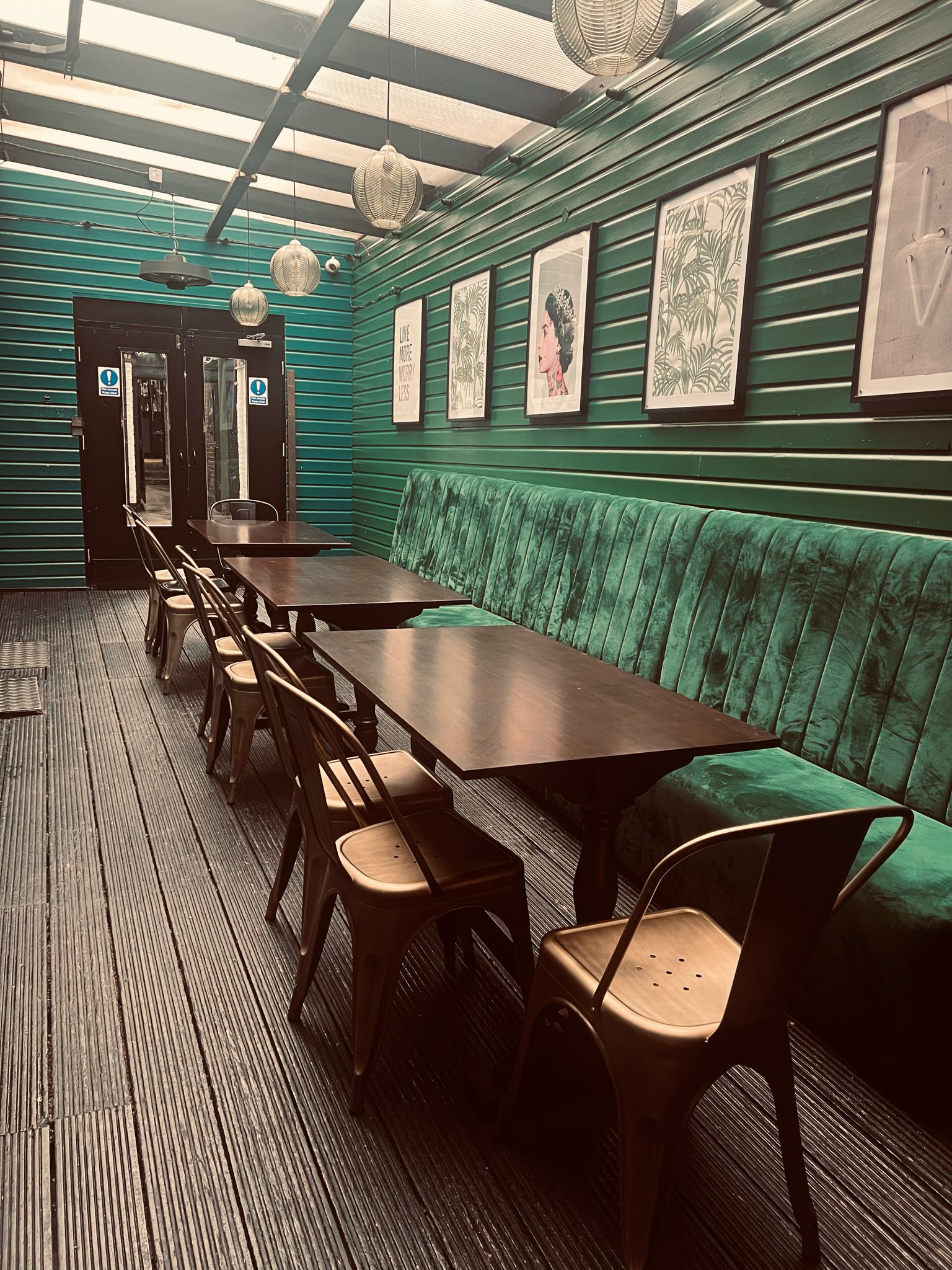 Stylish Green Room at The Griffin, featuring plush seating for meetings and brainstorming.