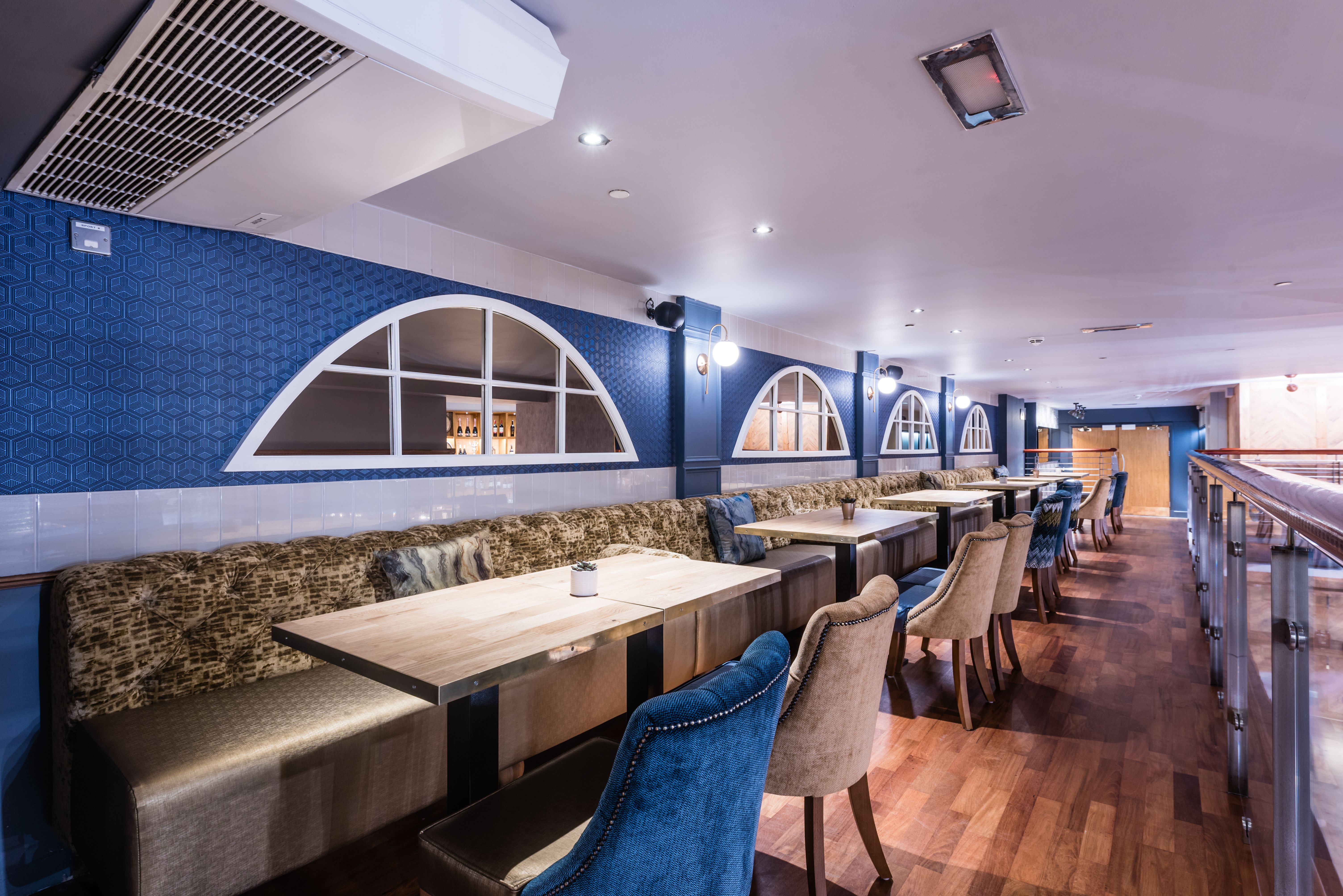 Prosecco Bar at Brewhemia: modern venue with arched windows for events and gatherings.