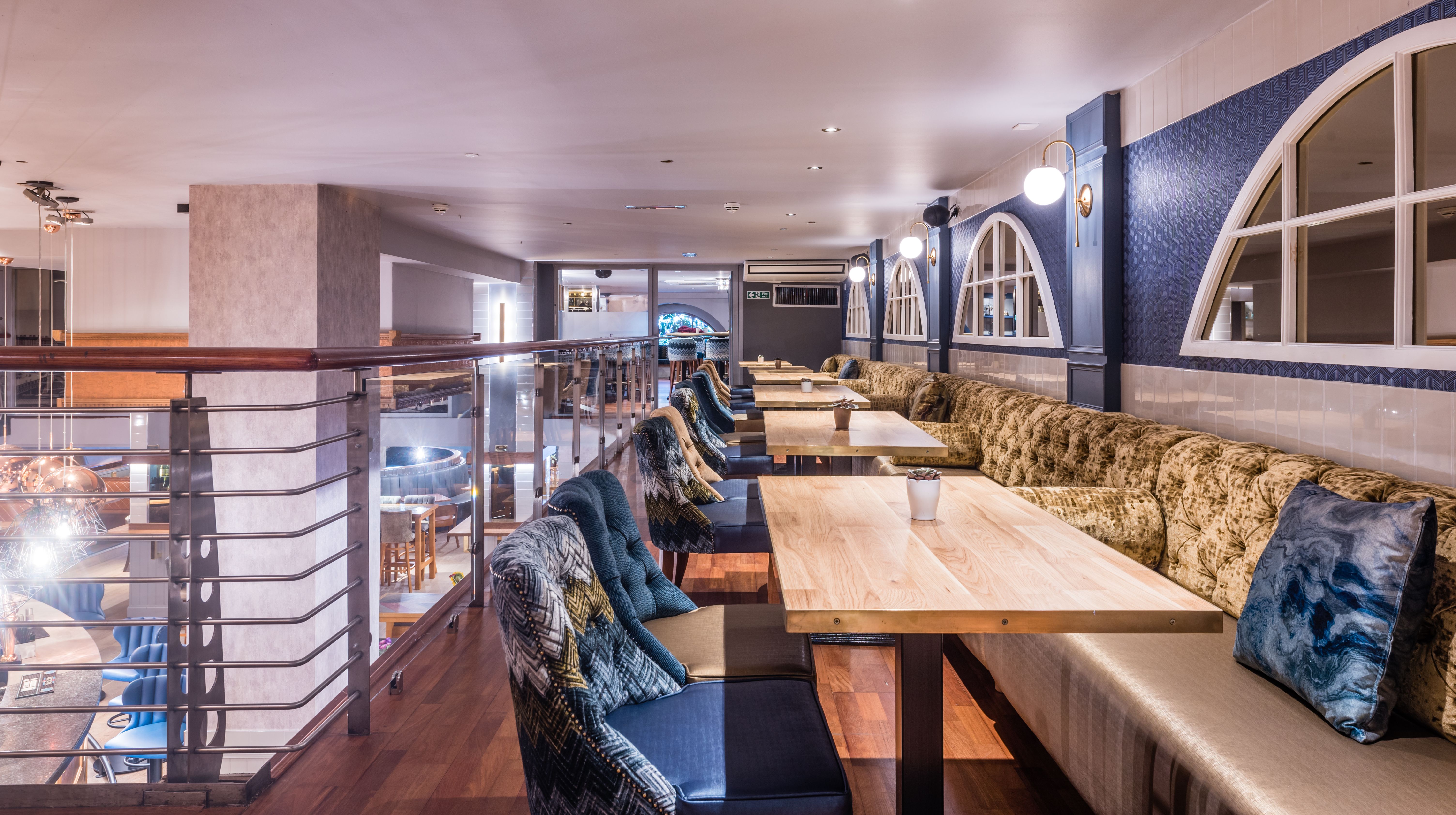 Prosecco Bar in Brewhemia, stylish event space with plush seating for gatherings.