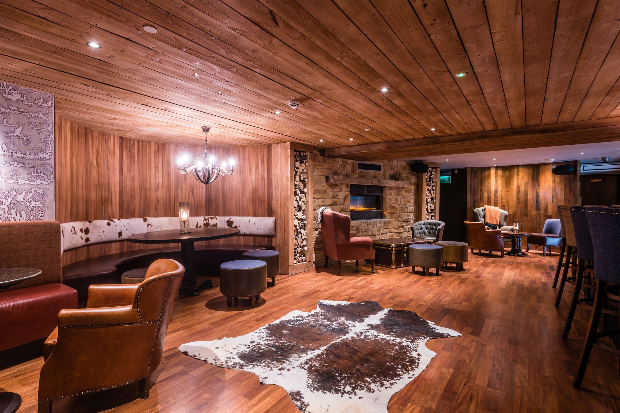 Cozy rustic lounge in Bothy, Brewhemia; ideal for winter networking events.