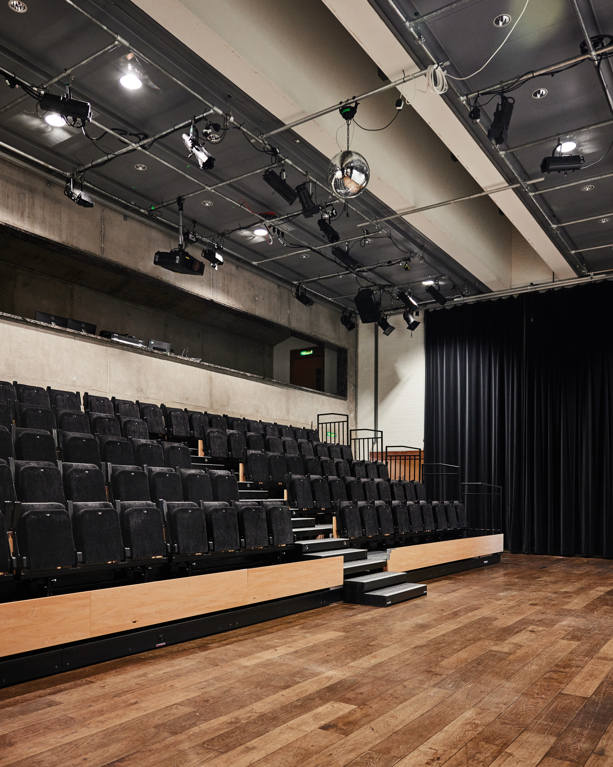Versatile auditorium with tiered seating at The Bluecoat for events and presentations.