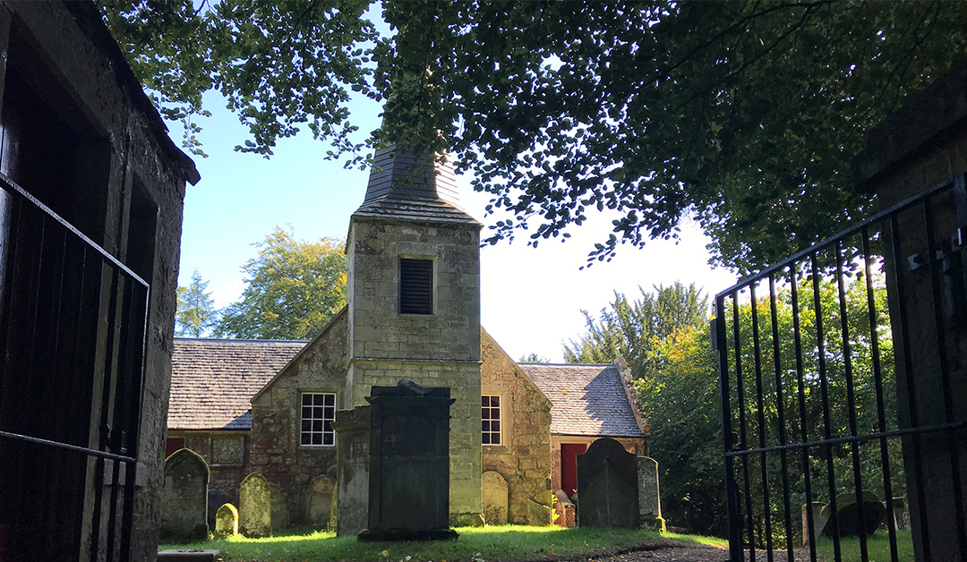 Old Kirk at Glencorse House, a rustic venue for weddings and events amidst greenery.