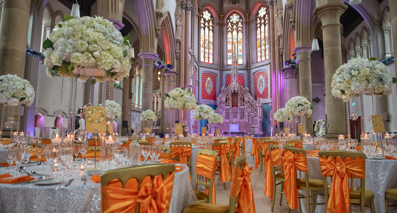 Elegant Manchester Monastery venue with stained glass, perfect for weddings and upscale events.