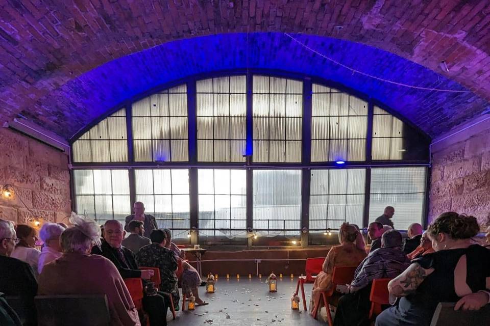Intimate event space in Leith Arches with candlelight, perfect for ceremonies and gatherings.