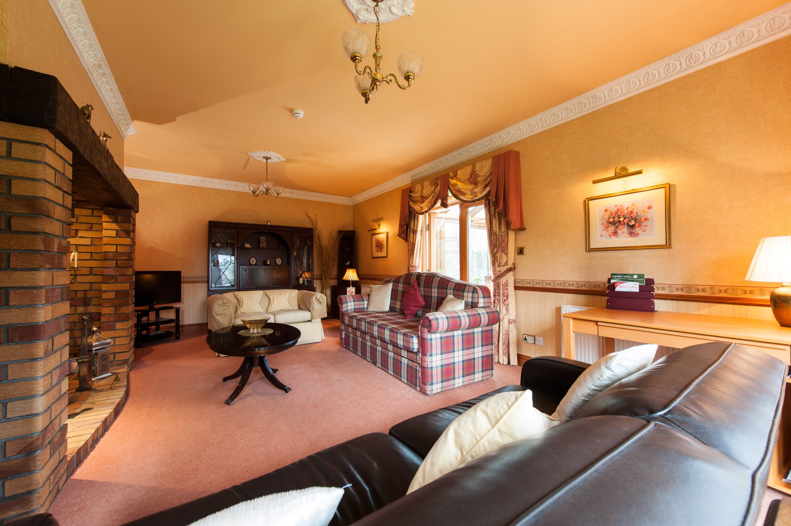 Cozy living room at Garden Lodge, ideal for meetings and team-building events.