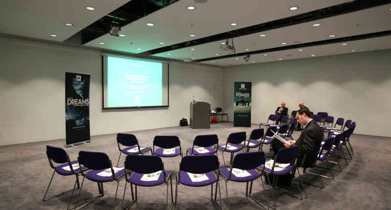 "SEC Meeting Academy hall with circular seating for engaging corporate events."