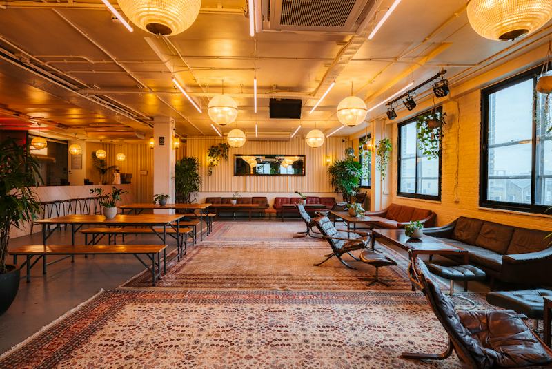 Loft-Inspired Bar at The Mash House, warm lighting, ideal for networking events.