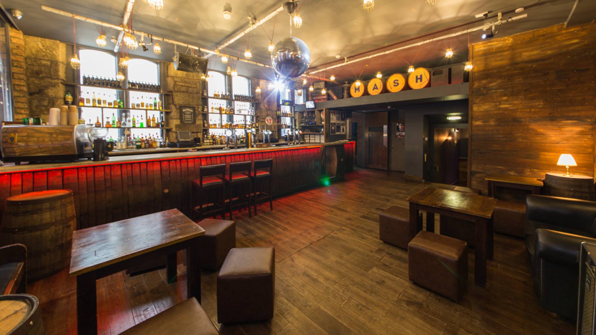 Loft-Inspired Bar at The Mash House, cozy wooden decor for networking events.