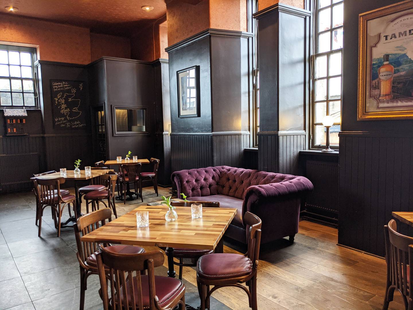 Cozy breakfast restaurant in Cannonball with elegant wooden tables for intimate events.