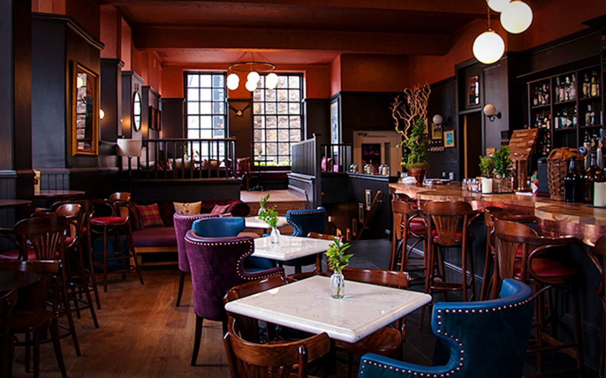 Private dining room with plush seating, perfect for intimate gatherings and networking events.