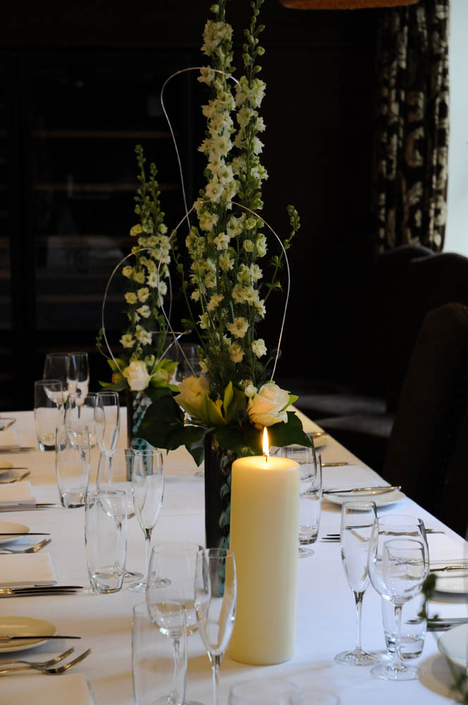 Elegant private dining room with floral arrangements for upscale events and gatherings.