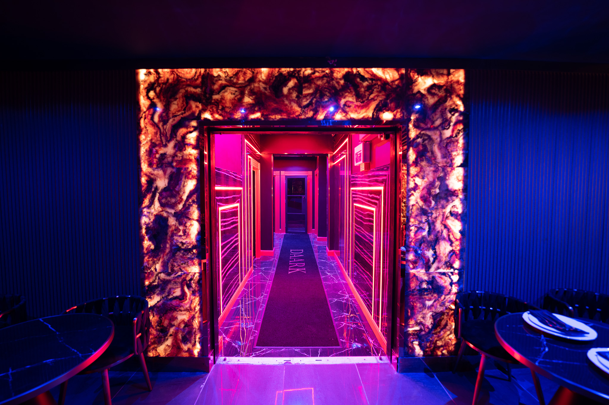 "Daark Venue entrance with vibrant lighting for upscale events and private parties."