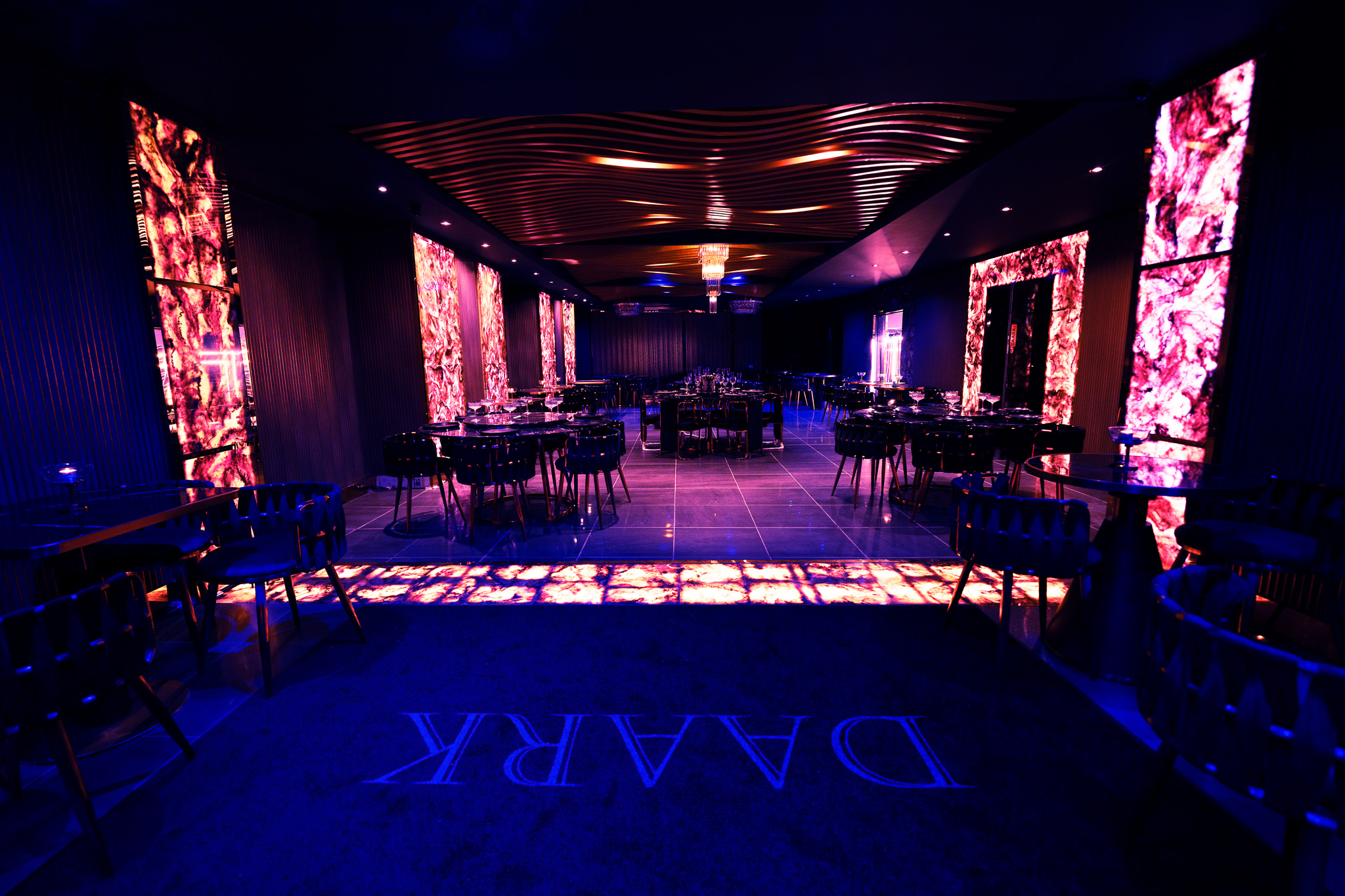 Modern event space at Daark Venue with vibrant lighting, ideal for upscale gatherings.
